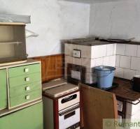 A kitchen with a traditional sideboard and stove in a family house, retro style.