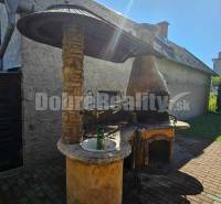 In Malá Lehota, near a family house, there is an outdoor fireplace with a stone sink.