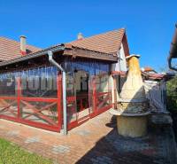 A family house in Malá Lehota with a terrace and a brick grill in the yard.