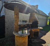 There is a garden grill with a shelter in the exterior of a family house in Malá Lehota.