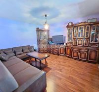 Living room in a family house with historical furniture and a wooden decor floor.
