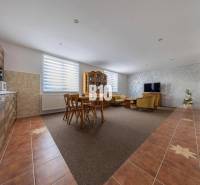 Open kitchen with living room and dining table in a family house.