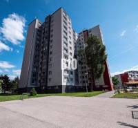 Apartment building in Bratislava on Andrusovova Street with surroundings and playground.