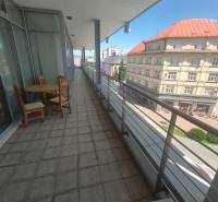 A balcony on J. Kotáčeka Street, overlooking the city of Zvolen and the surrounding offices.