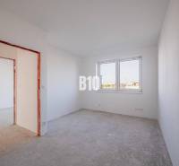 Empty room in a family house with white walls and a window.