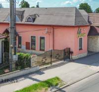 Family house on Gyula Szabó Street in Dunajská Streda with a pink facade and stone details.