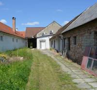Exterior near commercial premises in Borský Svätý Jur with a garden and buildings.