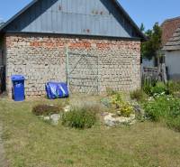 In Borský Svätý Jur, you can see commercial spaces with a brick structure and a garden.