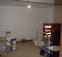 A warehouse in commercial premises with materials and tools, without partitions or equipment.