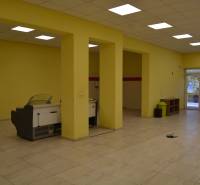 Commercial spaces with yellow walls and furnishings.