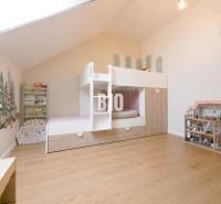 Children's room with a bunk bed and wooden floor in a 3-room apartment.