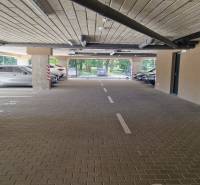 Underground parking spaces with cars near a 2-room apartment on Sadová Street in Senica.
