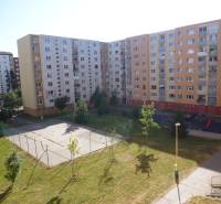 Housing estate in Prešov on Lomnická Street, with a children's playground and a sports area.