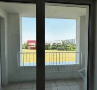 A balcony with a view of the surroundings in a 2-room apartment.
