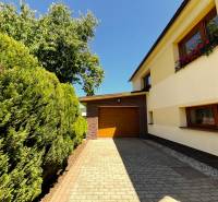 A family house in Kriváň on Kriváň Street with a garage and a landscaped garden.
