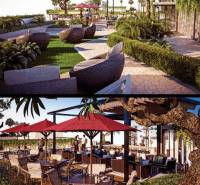 Garden and outdoor seating during apartment construction in Pattaya, surrounded by greenery.