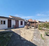 The courtyard of a family house on Riadok in Malacky with older amenities and a garden.