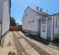 Family house on Riadok Street in Malacky with a yard featuring gravel and concrete.