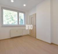 A bright room with a window and a radiator in a 3-room apartment.