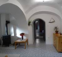 Brick vaults and a stove in the cozy interior of a family house.