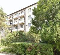 An apartment building surrounded by greenery on Smolnícka Street in Bratislava - Ružinov, with balconies.