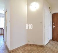 Entrance hall with ceramic tiles in a 4-room apartment displayed.