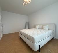 Bedroom in a 3-room apartment with a bed and light wood flooring pattern.