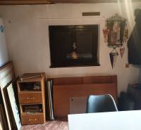 Interior of a cabin with furniture and decorations, simple space.