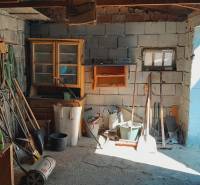 A garage full of tools and equipment under construction of apartments.