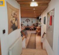 Interior of dining spaces with decorations and wooden elements. The entrance leads to the tables.