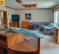 Interior of dining spaces with wooden furniture and comfortable sofas.