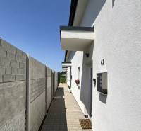 A view of the side alley and facade at the family house on Magnolia Street in Vrakuňa.