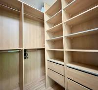 Built-in wardrobe with shelves and drawers in a 2-room apartment.
