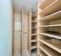 Built-in shelves and racks for storage space in a 2-room apartment.