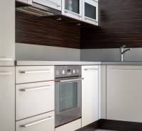 Kitchen in a 3-room apartment with a sink, oven, and cabinets.