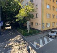 Karadžičova Street in Bratislava - Old Town with a building and parked cars.