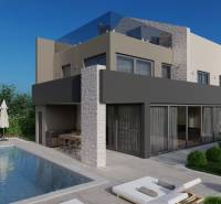 Villa in Poreč with a pool, terrace, sun loungers, and greenery in a peaceful environment.