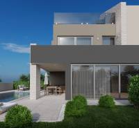 Villa in Poreč with a garden, pool, and terrace under the blue sky.