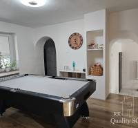 A billiard room with a pool table in a family house, elegant decoration and cozy atmosphere.