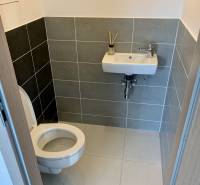 Bathroom in a 2-room apartment with a toilet and a sink.