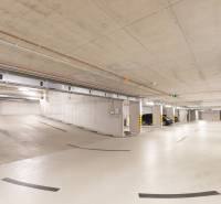 Underground garages with parked cars and a ramp in Bratislava - Ružinov on Košická Street.