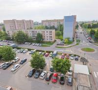 A view of the parking lot and apartment buildings on Veterná Street in Trnava, ideal for a 3-bedroom apartment.