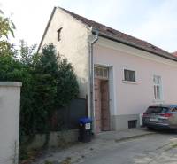 A family house on Hviezdoslavova Street in Piešťany with a car parked on the sidewalk.