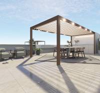 Terrace of a 4-bedroom apartment in Pilar de la Horadada with a pergola and garden furniture.