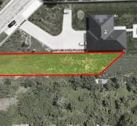 Aerial view of a residential plot in Nové Mesto nad Váhom, next to an asphalt road.