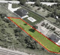 Aerial view of plots - housing in Nové Mesto nad Váhom, enclosed by a red line.
