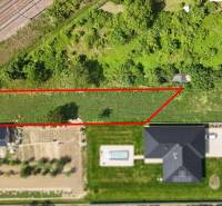 Land near the railway suitable for living in Nové Mesto nad Váhom, surrounded by greenery.