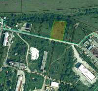 Aerial view of commercial land in Ľubotín, showing infrastructure and parcel boundaries.
