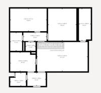 A floor plan of an apartment with three rooms, a kitchen, and other spaces for practical living.