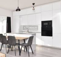 A kitchen in a family house with a white kitchen unit, a dining table, and modern lighting.